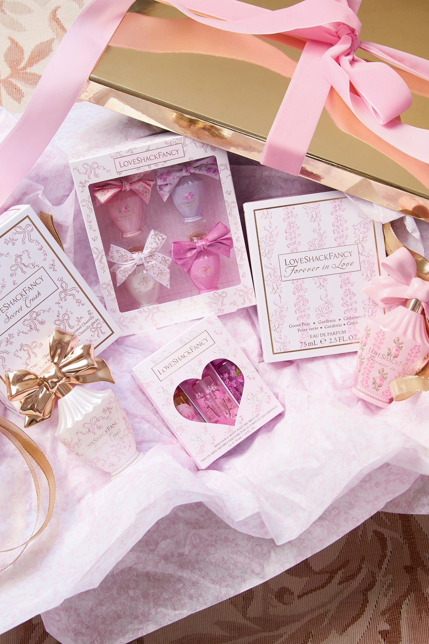 Women sitting in grass field wearing LoveShackFancy Slip Dresses