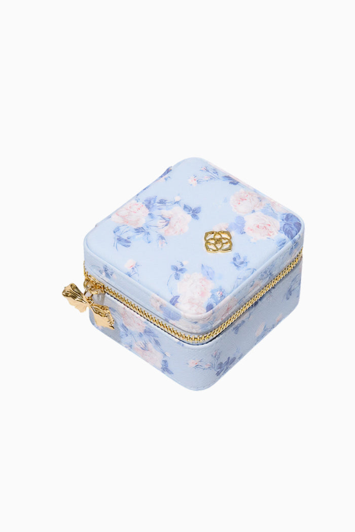 Floral-patterned jewelry box with gold accents on a white background